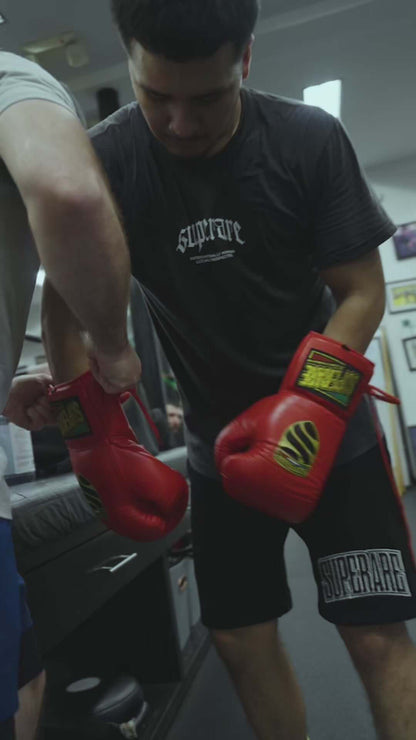 Athlete training with Superare S40 red boxing gloves, showcasing the passion and spirit of real fighters.