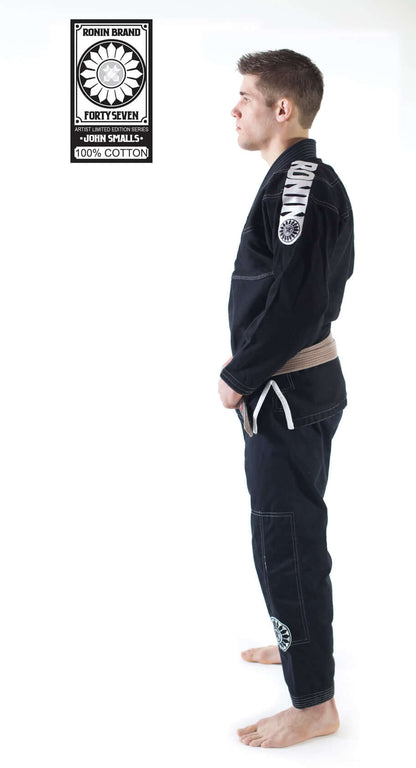 Side view of a male model wearing Roninbrand 47 BJJ Gi in Black, showcasing comfort and fit designed for fighters.