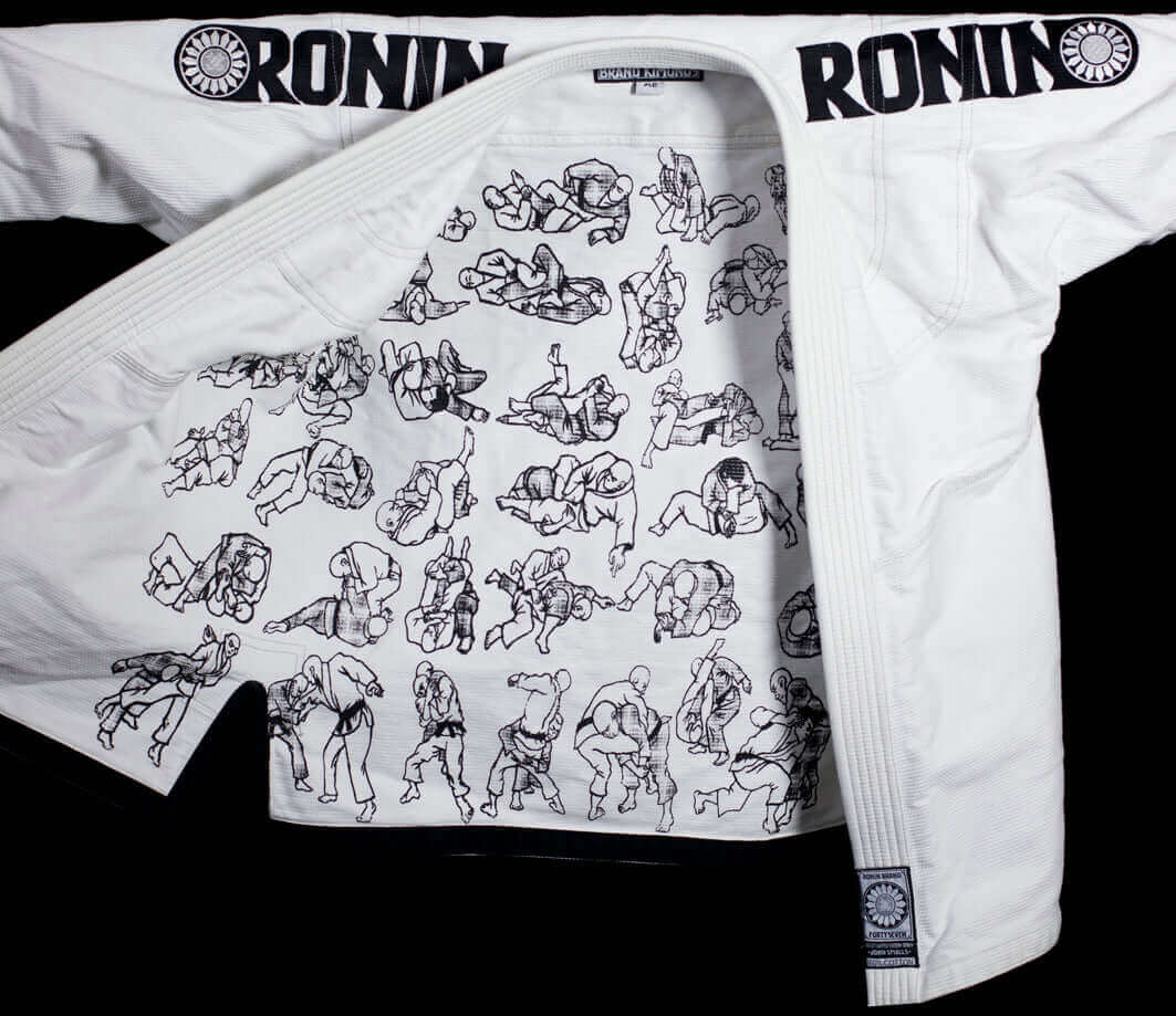 Ronin BJJ gi featuring colorful illustrations on the interior, showcasing grappling techniques. Perfect for BJJ enthusiasts.