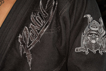 Close-up of Ronin brand logo and samurai design on Blackout Samurai Ghost BJJ Gi, representing elite craftsmanship.