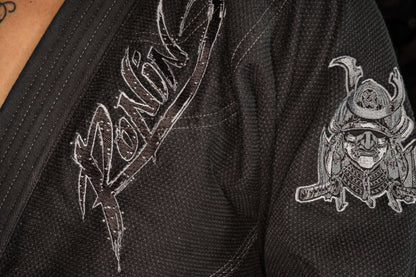 Close-up of Ronin brand logo and samurai design on Blackout Samurai Ghost BJJ Gi, representing elite craftsmanship.