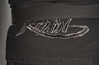 Close-up of Ronin logo on the black Samurai Ghost BJJ Gi, showcasing its quality and design for elite fighters.