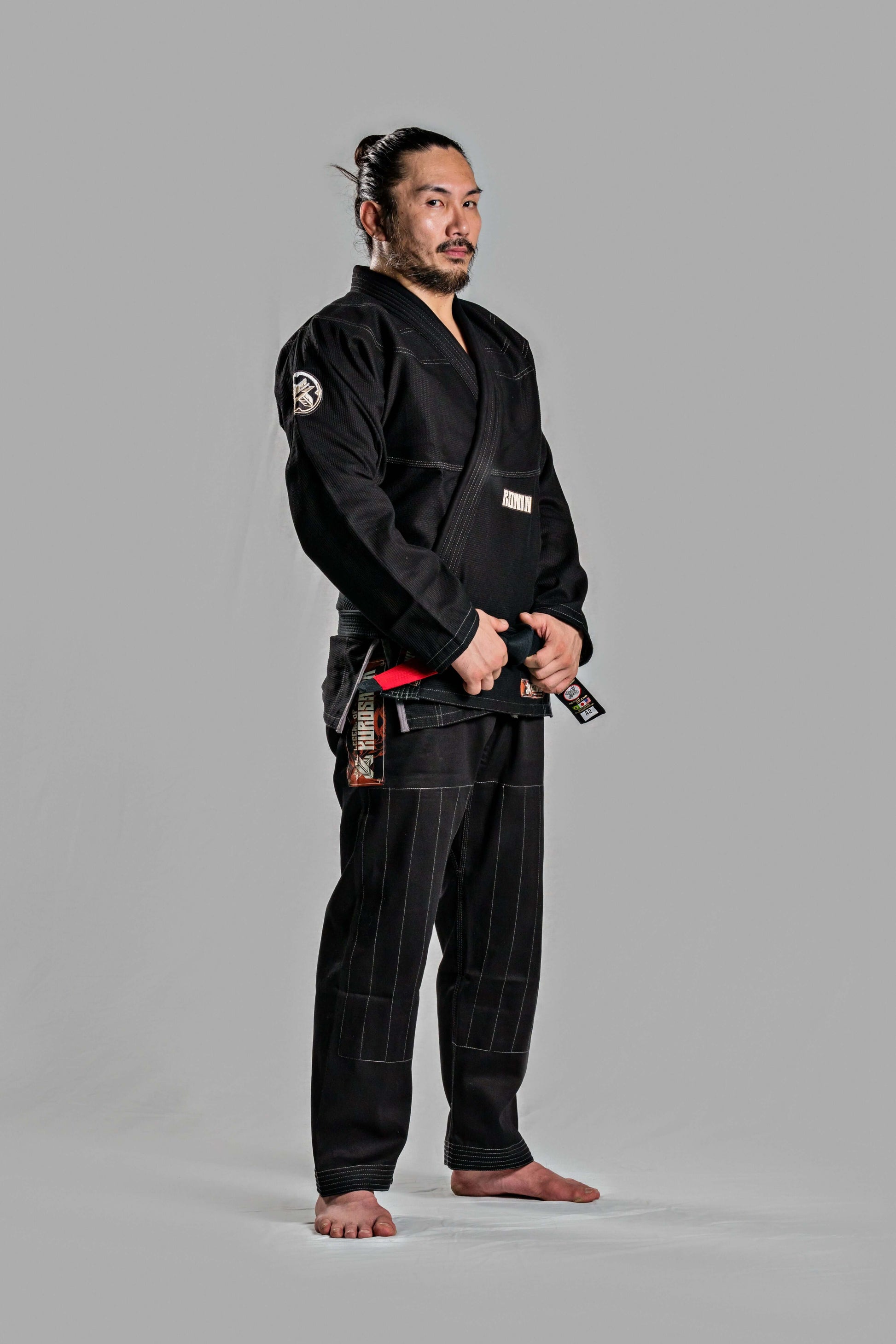 Model wearing Roninbrand Kurosawa BJJ Gi in black, showcasing comfort and style for professional Brazilian Jiu Jitsu.
