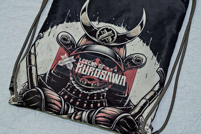 Legend of Kurosawa graphic drawstring bag featuring a samurai design, inspired by Akira Kurosawa's cinematic legacy.