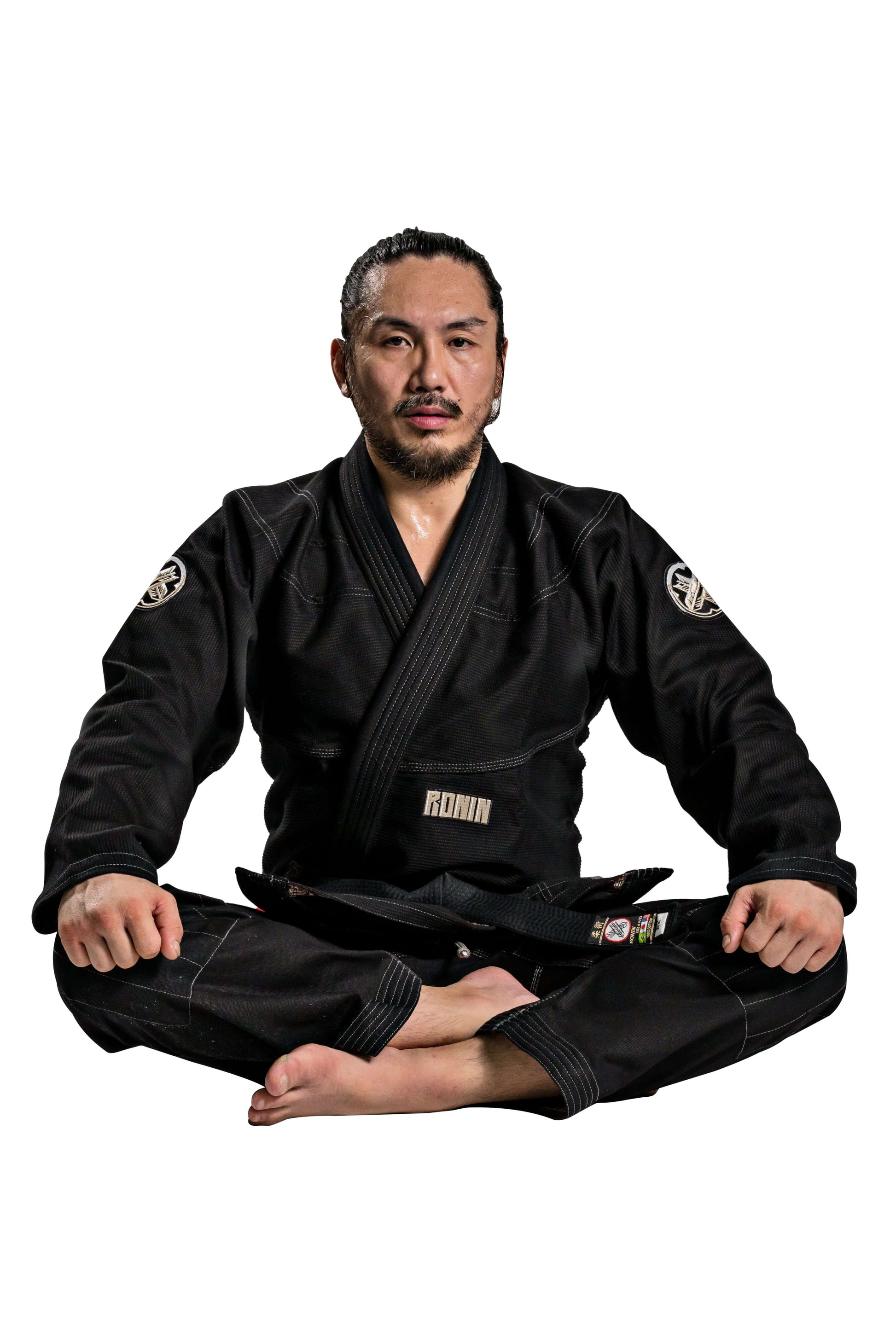 Man in Roninbrand Kurosawa BJJ Gi, showcasing professional Brazilian Jiu Jitsu attire for fighters, designed in America.