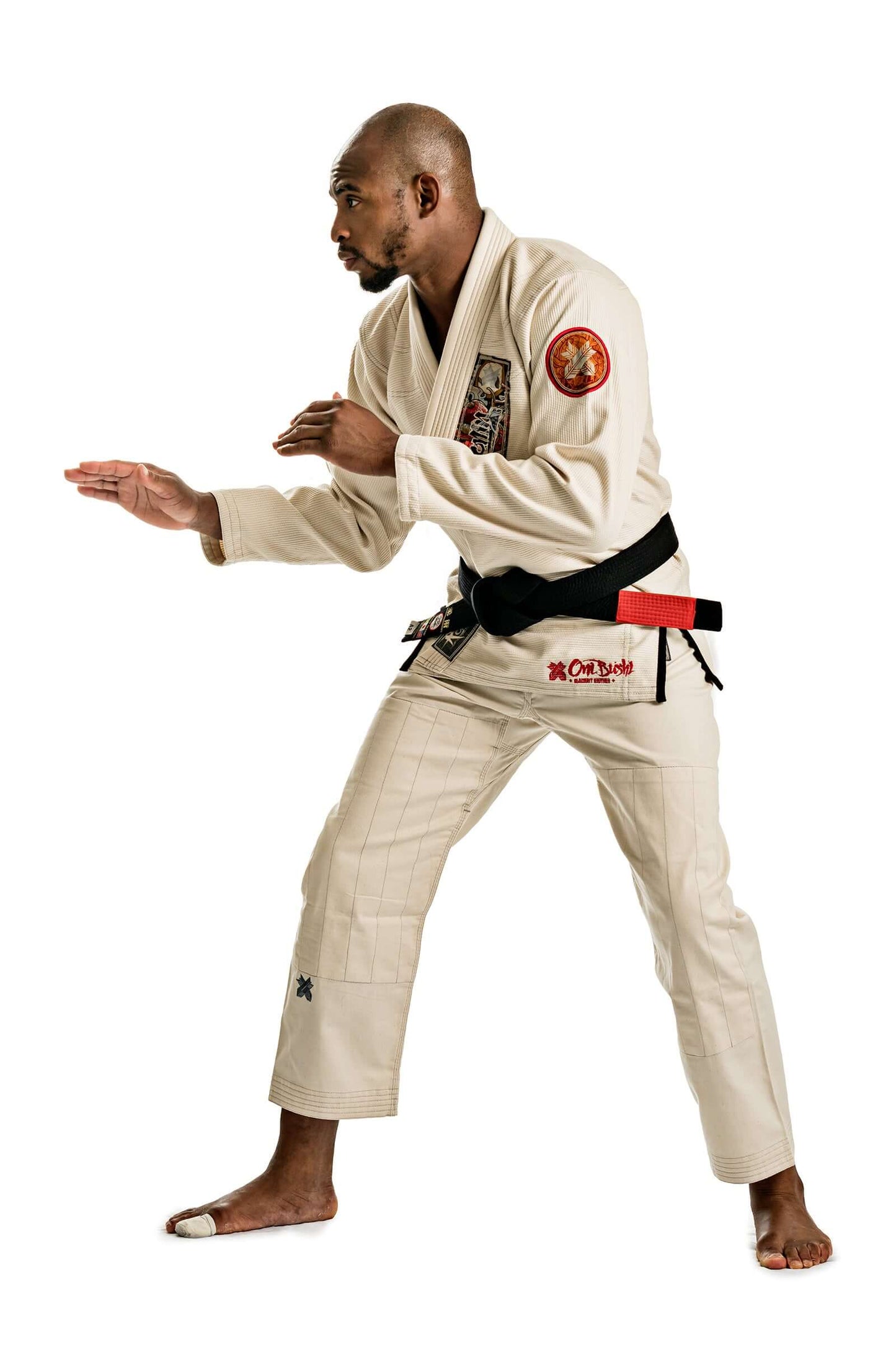 Unbleached Oni Bushi BJJ Gi showcased by a fighter in a combat stance, reflecting precision and style in Brazilian Jiu Jitsu.