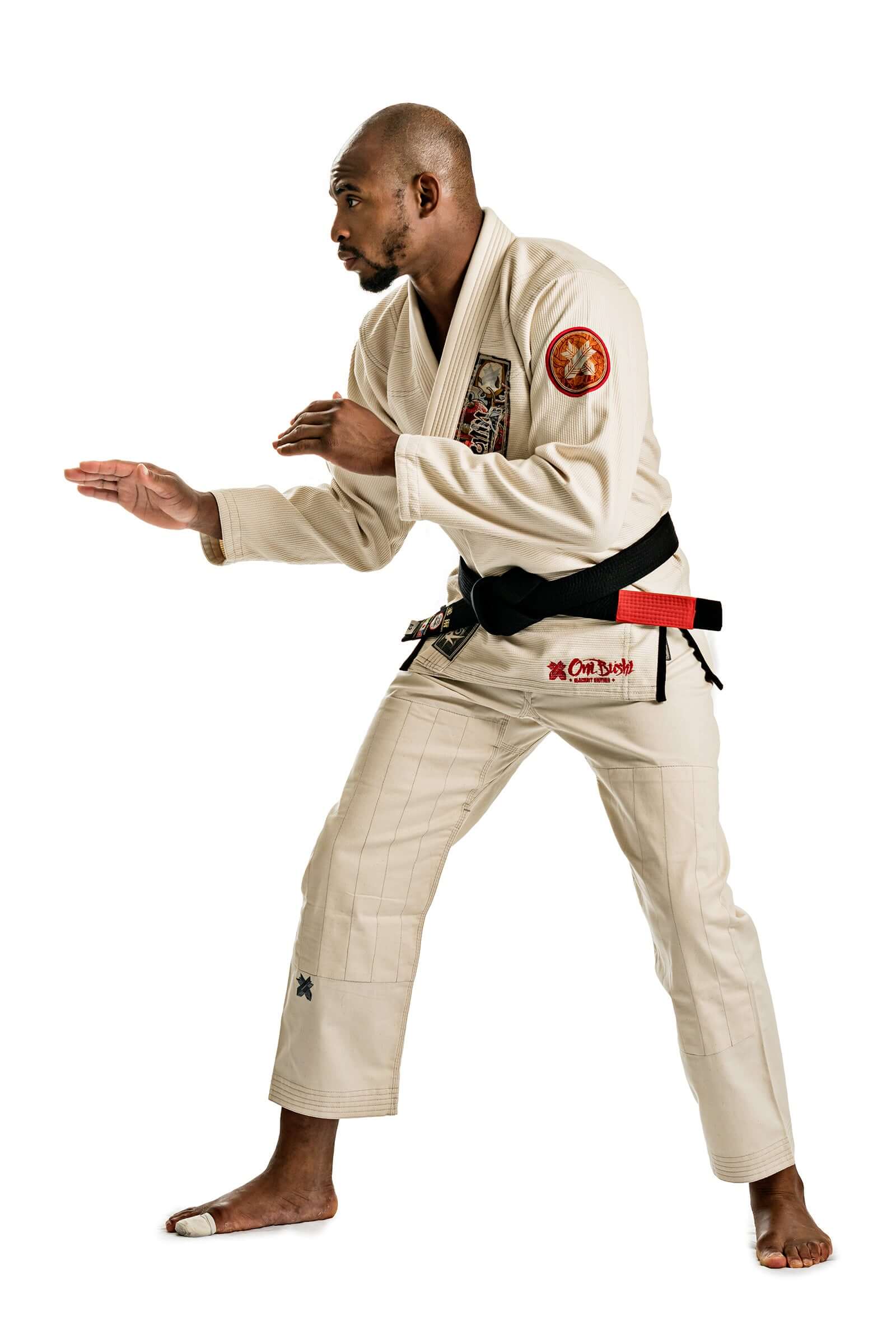 Unbleached Oni Bushi BJJ Gi showcased by a fighter in a combat stance, reflecting precision and style in Brazilian Jiu Jitsu.