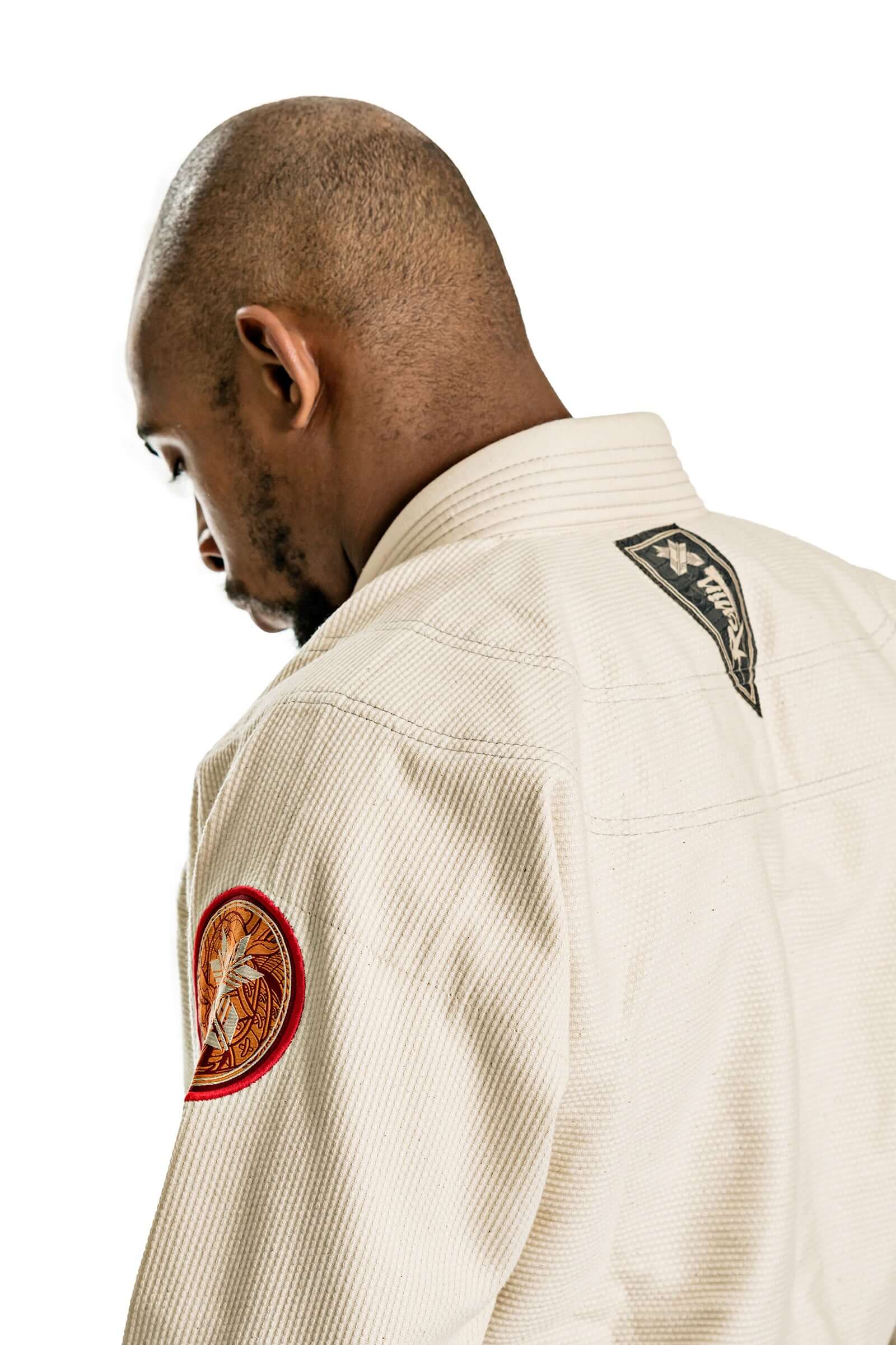 Model showcasing the Roninbrand Oni Bushi BJJ Gi in unbleached fabric, highlighting premium quality and detail.