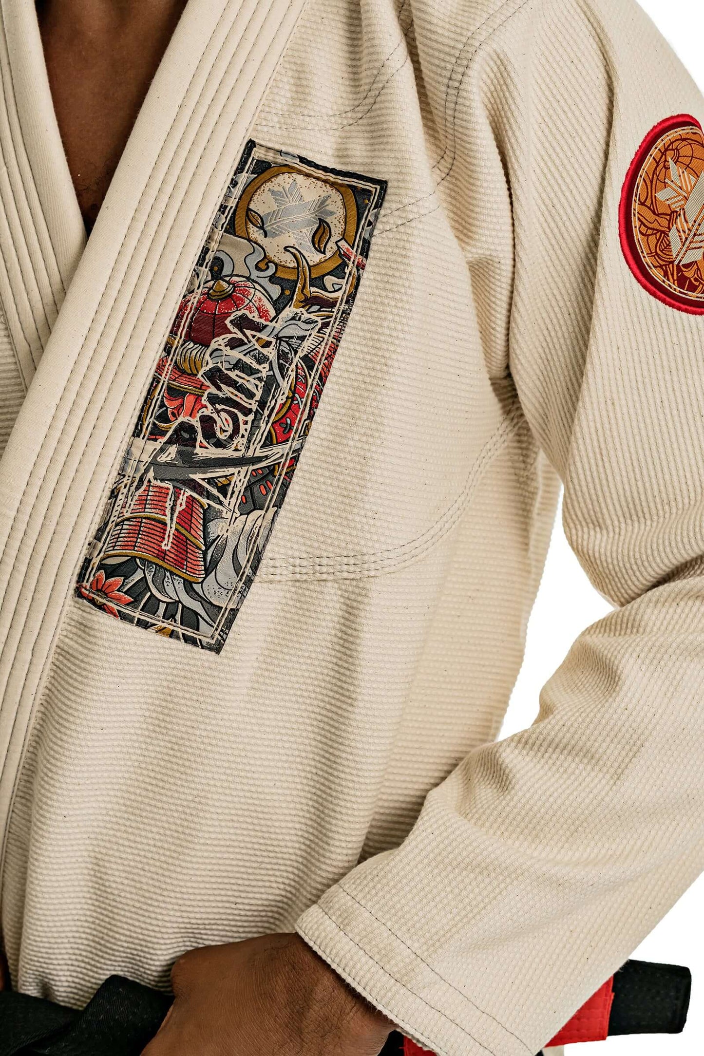 Roninbrand Oni Bushi BJJ Gi in unbleached fabric showcasing intricate designs and embroidery for professional grappling and Jiu Jitsu.