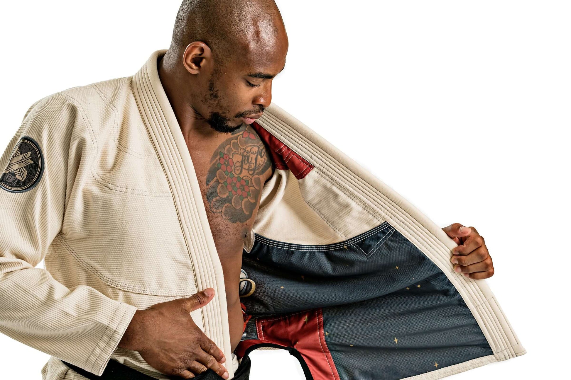 Man showcasing the inside of Roninbrand Oni Bushi BJJ Gi, highlighting comfort and design for Brazilian Jiu Jitsu.