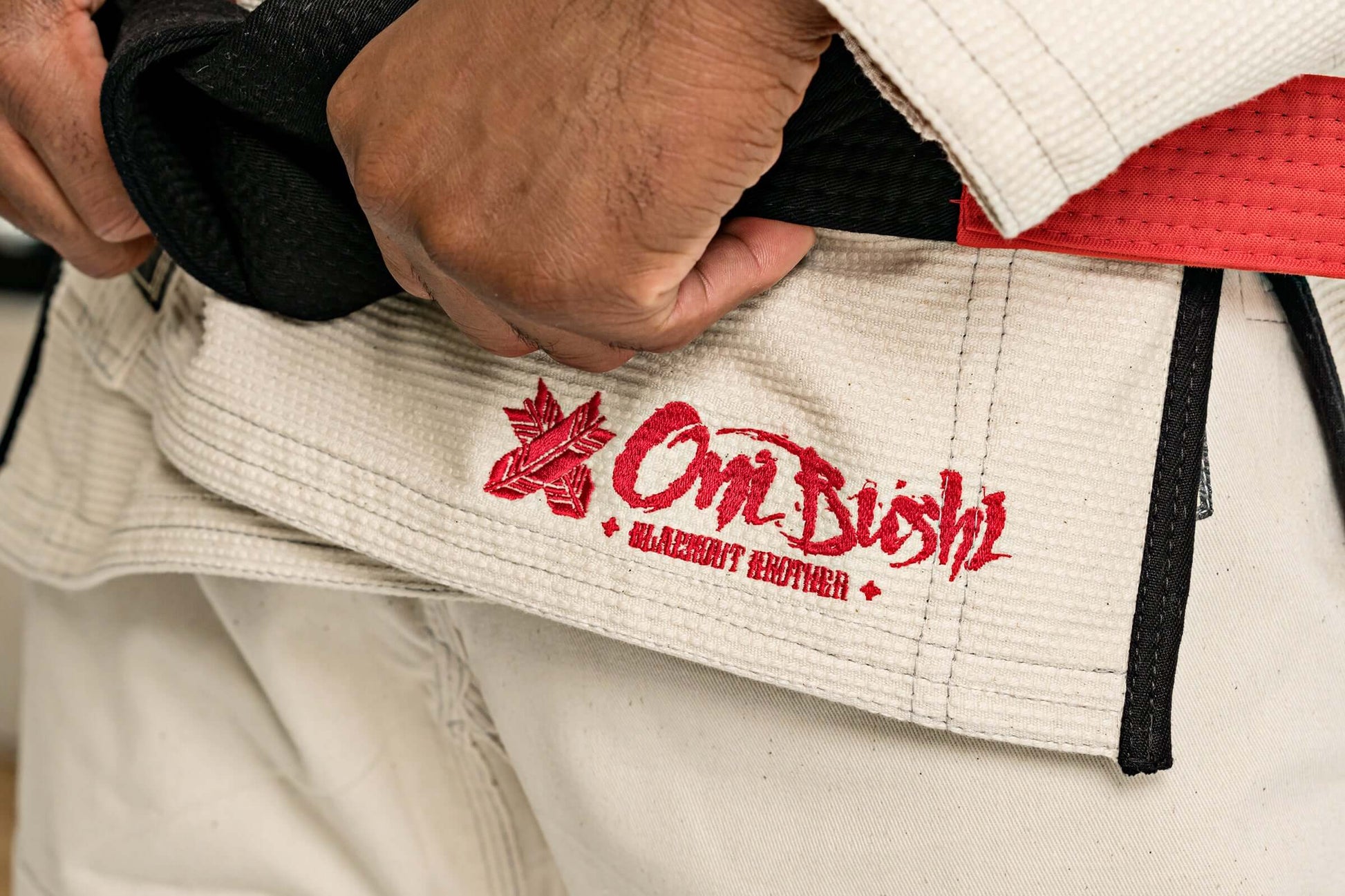 Close-up of Roninbrand Oni Bushi BJJ Gi showcasing logo detail and black belt tie.