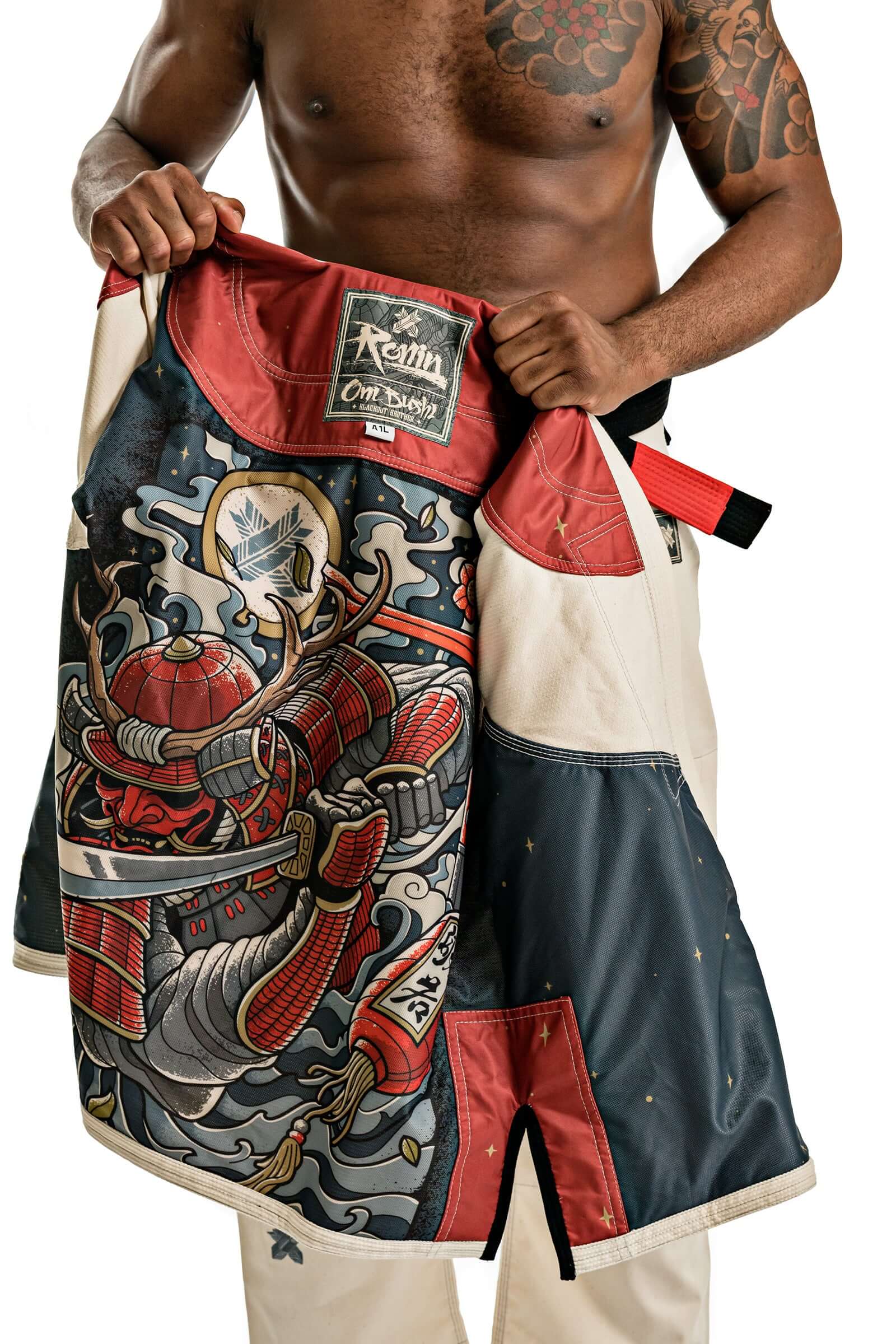 Man showcasing Roninbrand Oni Bushi BJJ Gi with detailed samurai artwork, designed for comfort and performance in Brazilian Jiu Jitsu.