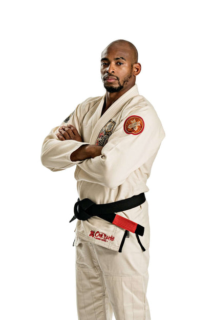 Model wearing Roninbrand Oni Bushi BJJ Gi, showcasing premium unbleached fabric and black belt in a striking pose.